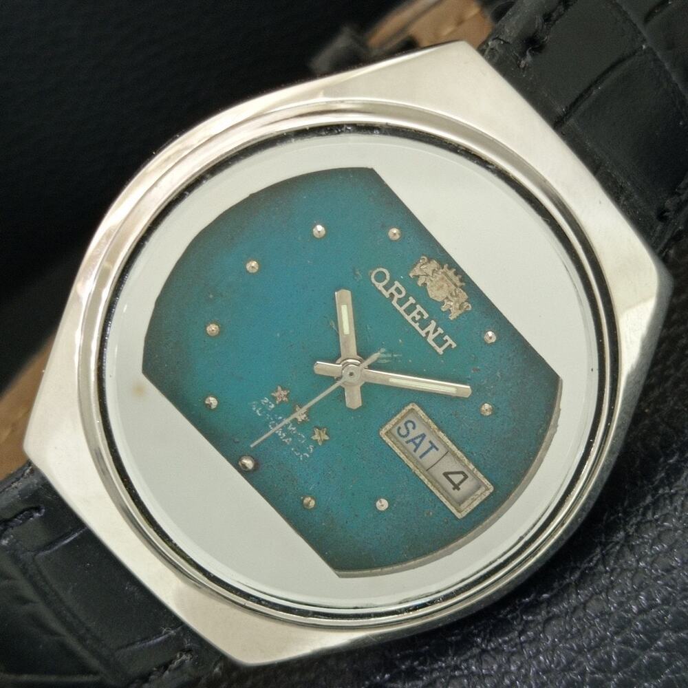 Vintage 1979 Orient Automatic Mens Silver Watch W/daydate & Teal accents